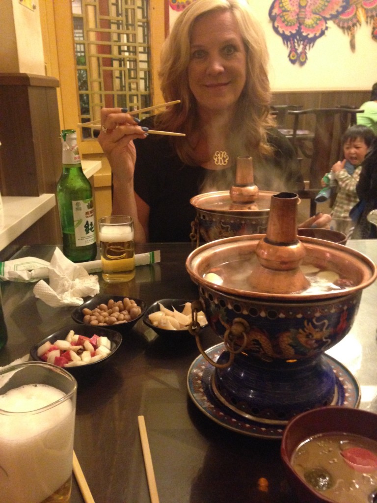 Mom trying a hot pot in Beijing. 
